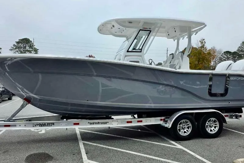 Slide: The Image of 2026 Sea Fox 288 Commander boat on trailer in parking lot. - 25