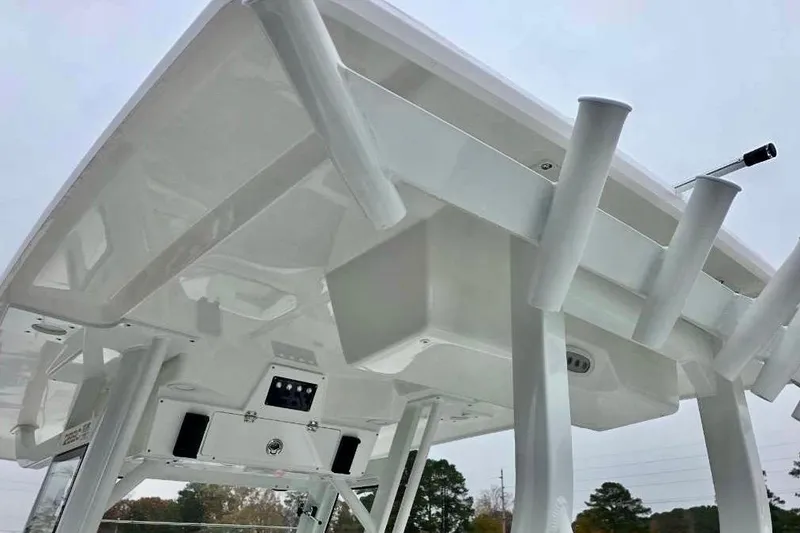 Slide: The Image of 2026 Sea Fox 288 Commander boat's T-top with rod holders and electronics. - 3