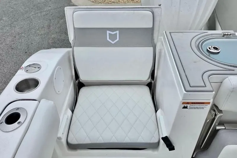 Slide: The Image of 2026 Sea Fox 288 Commander boat seat with diamond-pattern upholstery and integrated cup holders. - 5