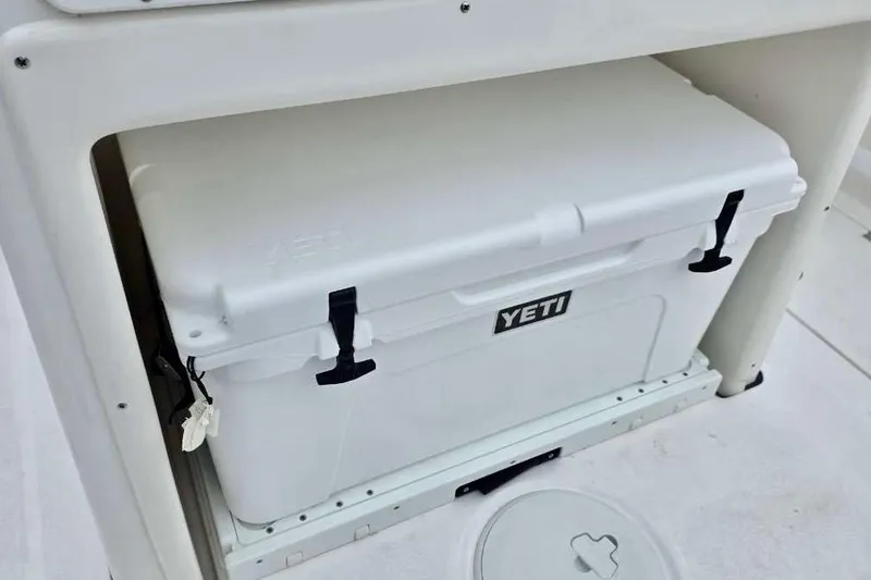 Slide: The Image of White YETI cooler on 2026 Sea Fox 288 Commander boat deck. - 6