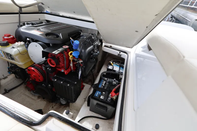 Slide: The Image of Engine compartment of a 2022 Cobalt 220S boat, showcasing engine and battery components. - 22