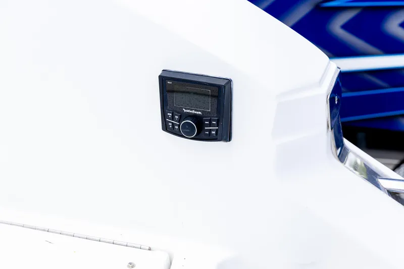Slide: The Image of Control panel on 2020 Cobalt 30SC Outboard boat, featuring sleek white design. - 11