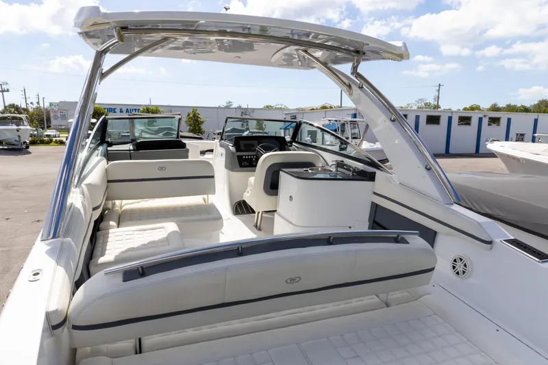 Slide: The Image of 2020 Cobalt 30SC Outboard boat interior with white seating and sleek design. - 15