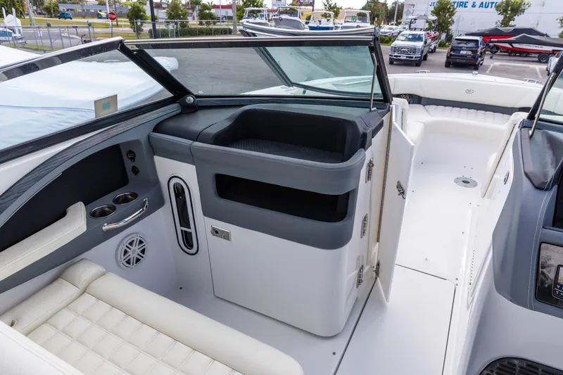 Slide: The Image of 2020 Cobalt 30SC Outboard boat interior with seating and storage compartments. - 16