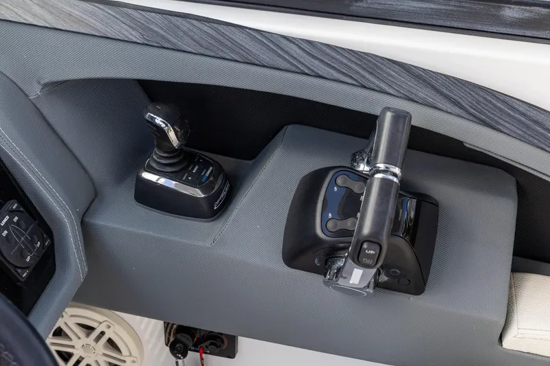 Slide: The Image of 2020 Cobalt 30SC Outboard boat controls with joystick and throttle lever. - 17