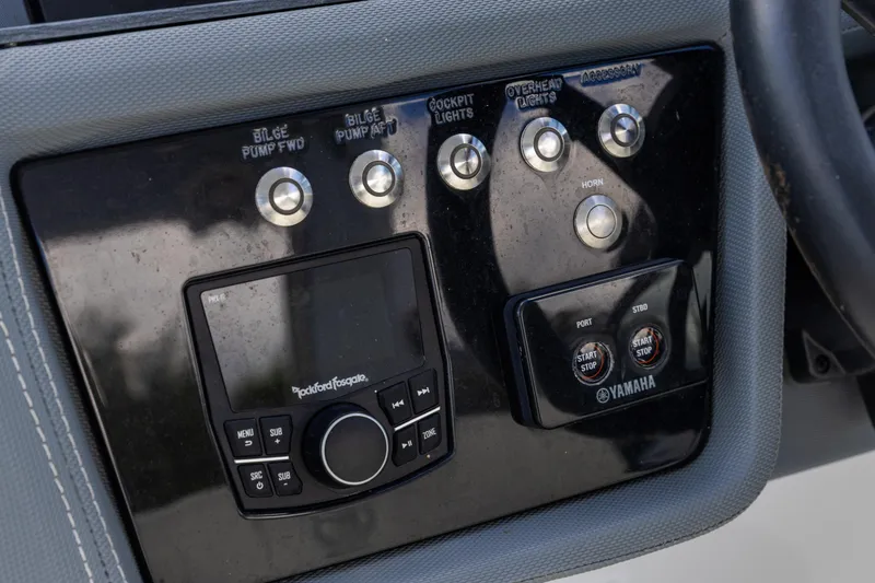 Slide: The Image of Control panel of a 2020 Cobalt 30SC Outboard boat with Yamaha start/stop buttons. - 19