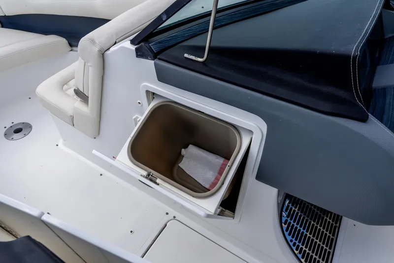 Slide: The Image of 2020 Cobalt 30SC Outboard boat interior with open storage compartment. - 22