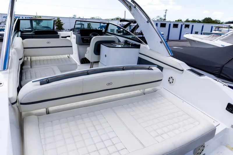 Slide: The Image of 2020 Cobalt 30SC Outboard helm with steering wheel and control panel. - 5