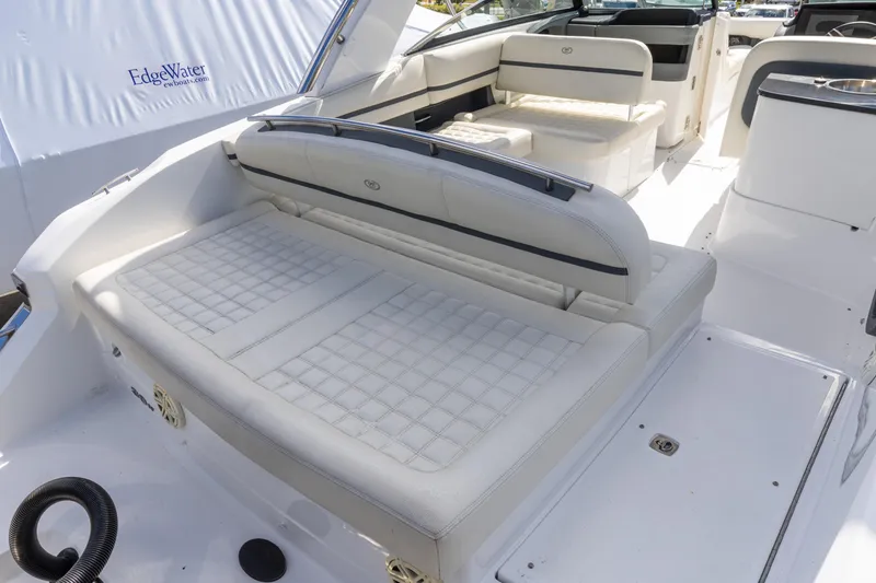 Slide: The Image of 2020 Cobalt 30SC Outboard boat interior with white cushioned seating. - 6