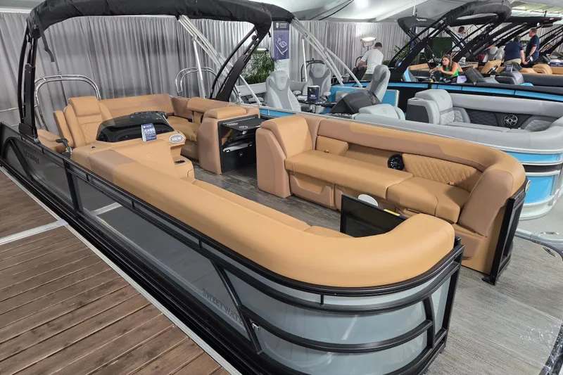 Slide: The Image of 2026 Godfrey SWEETWATER 2486 SFL pontoon boat with tan seating and modern design. - 1