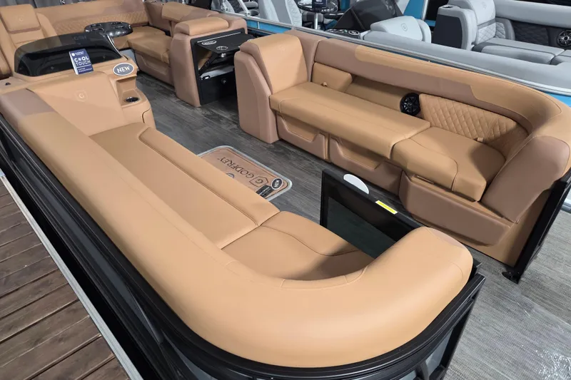 Slide: The Image of Luxurious interior of 2026 Godfrey SWEETWATER 2486 SFL pontoon boat with tan seating. - 2