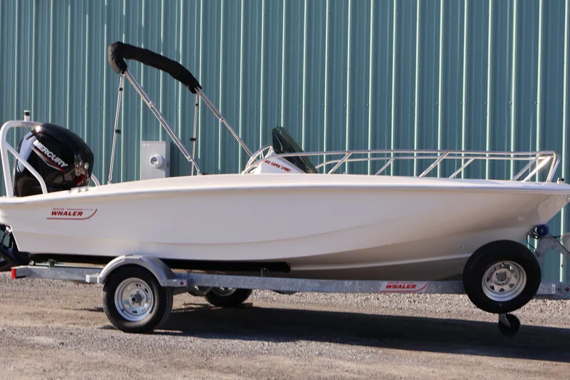 The Image of 2026 Boston Whaler 160 Super Sport boat on trailer, parked outdoors. - 0
