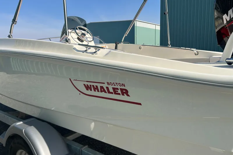 Slide: The Image of 2026 Boston Whaler 160 Super Sport boat on trailer, side view. - 17
