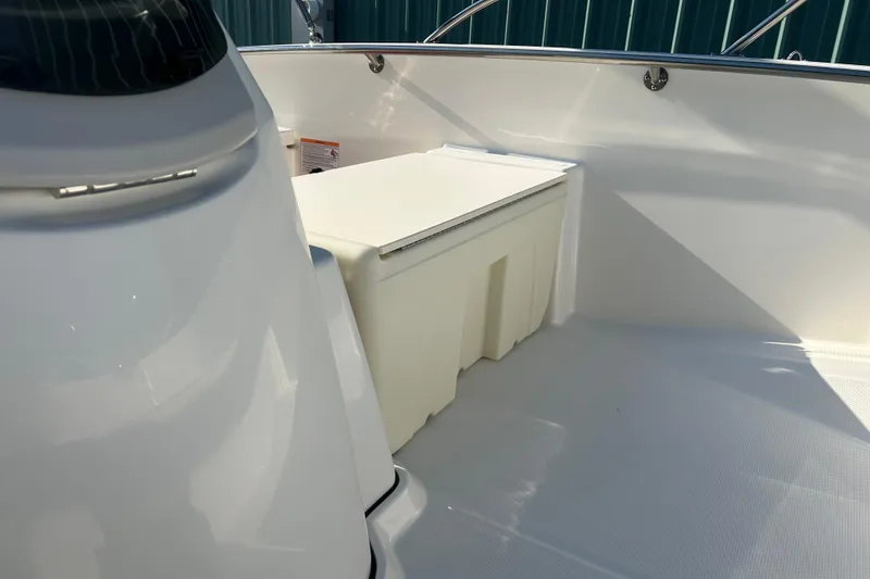 Slide: The Image of 2026 Boston Whaler 160 Super Sport interior with storage compartment and sleek design. - 18