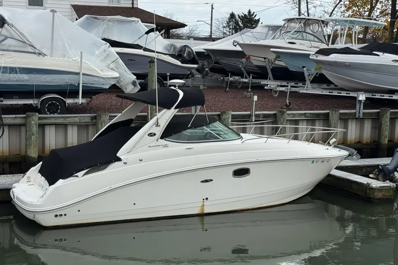 The Image of 2013 Sea Ray 280 Sundancer docked at marina with other boats. - 0