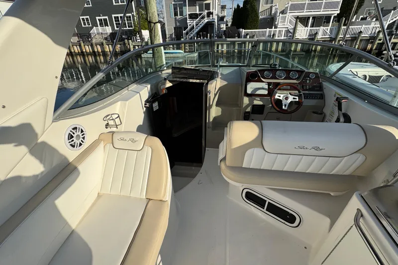 Slide: The Image of Interior view of a 2013 Sea Ray 280 Sundancer boat with seating and control panel. - 12