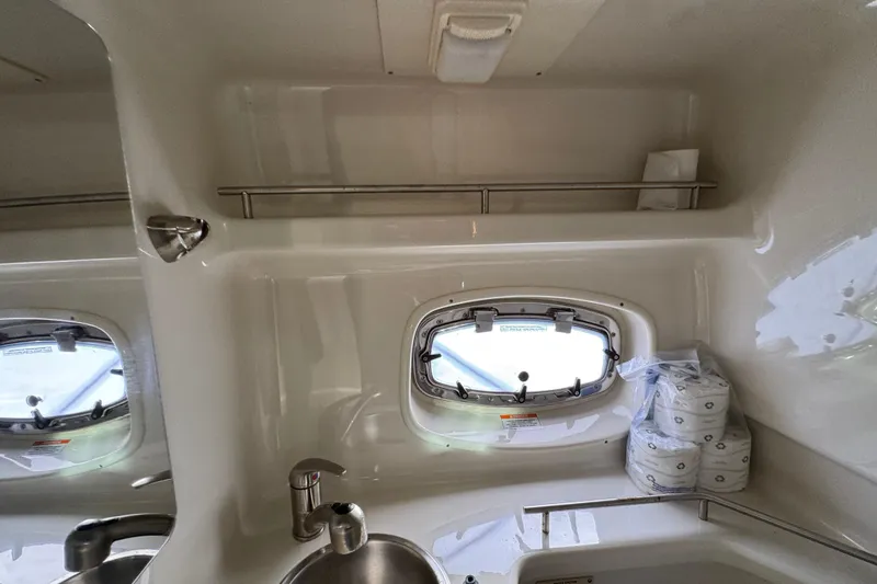 Slide: The Image of Interior of 2013 Sea Ray 280 Sundancer boat with sink and porthole window. - 28