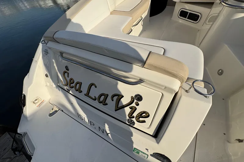Slide: The Image of 2013 Sea Ray 280 Sundancer boat with "Sea La Vie" name on the stern. - 6
