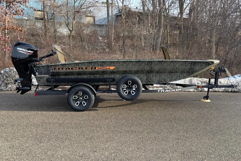 The Image of 2026 Tracker Grizzly 1756 T Marsh boat on trailer, parked on road. - 0