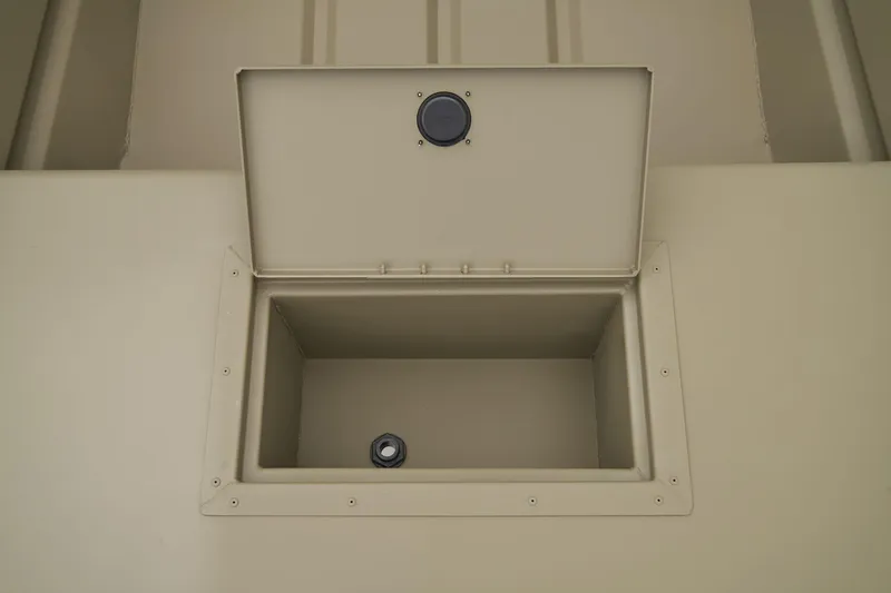 Slide: The Image of Open storage compartment in 2026 Tracker Grizzly 15 Jon boat. - 5