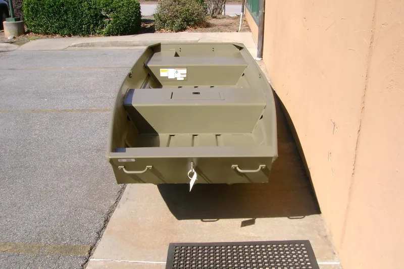 Slide: The Image of 2026 Tracker Grizzly 15 Jon boat in outdoor setting, showcasing its sturdy design. - 6