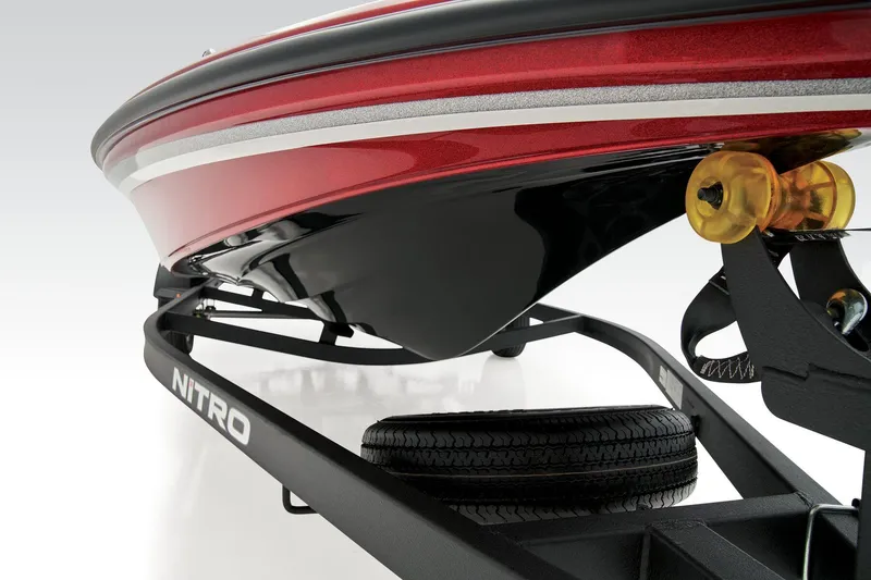 Slide: The Image of 2026 Nitro Z17 boat interior with open storage compartments and carpeted deck. - 9