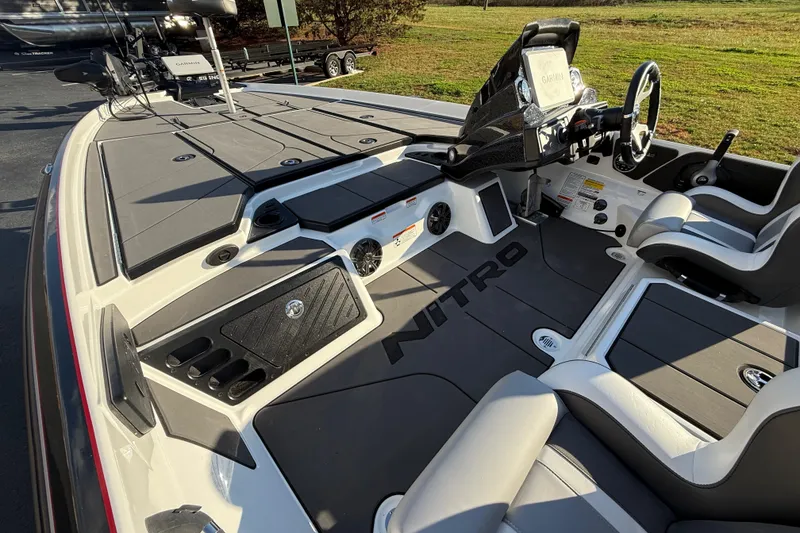 Slide: The Image of 2026 Nitro Z21 XL Pro boat interior with advanced dashboard and seating. - 89