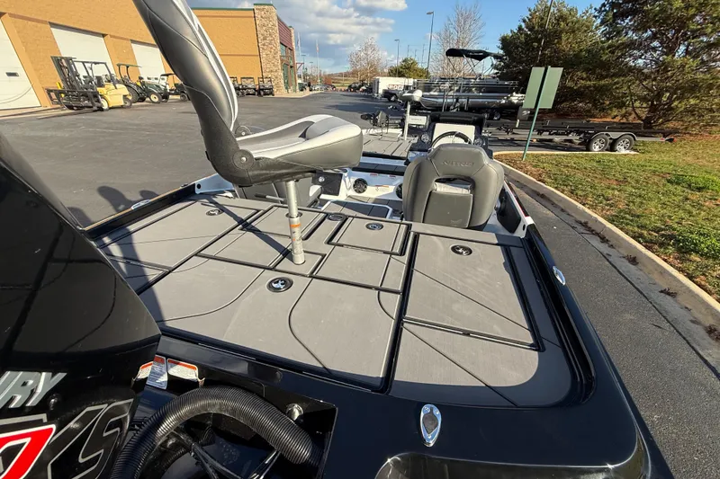 Slide: The Image of 2026 Nitro Z21 XL Pro boat with seating and storage, parked outdoors. - 93