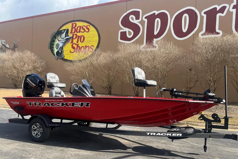 The Image of 2026 Tracker Pro Team 195 boat in red, parked at Bass Pro Shops. - 0