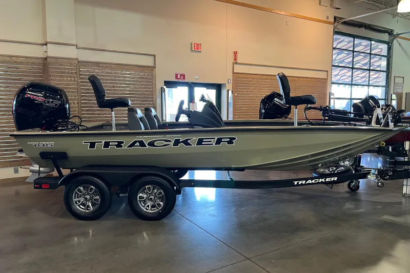 The Image of 2026 Tracker Pro Team 195 boat displayed indoors on a trailer. - 0