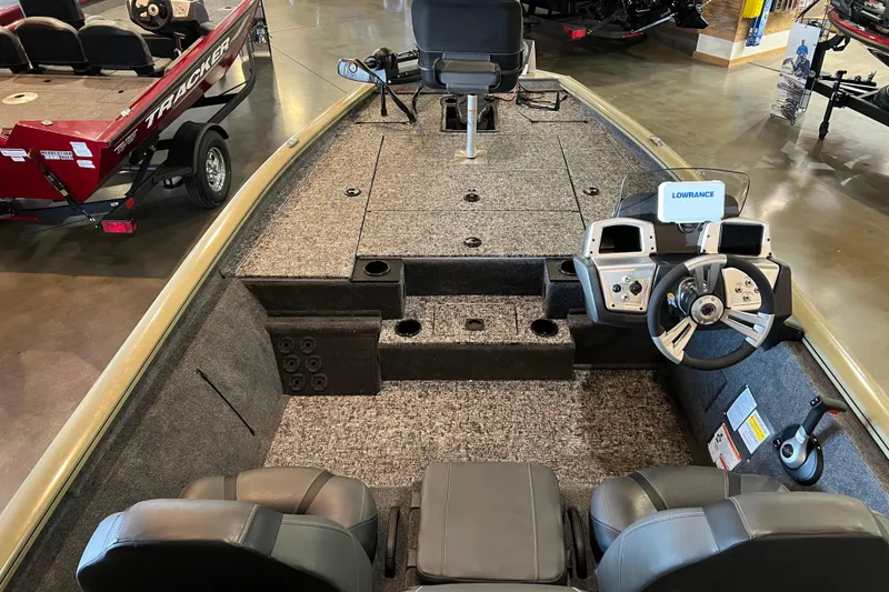 Slide: The Image of 2026 Tracker Pro Team 195 boat interior with steering console and seating. - 5