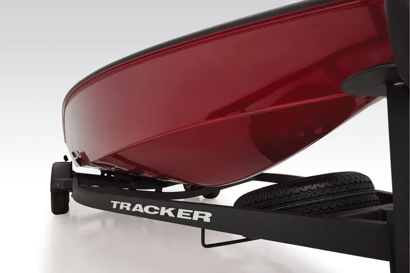 Slide: The Image of 2026 Tracker Savage 215 boat storage compartment with Garmin equipment and Brownie's Marine branding. - 8