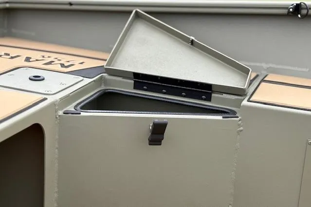 Slide: The Image of Open storage compartment on 2026 Tracker Grizzly 1756 T Marsh boat. - 19