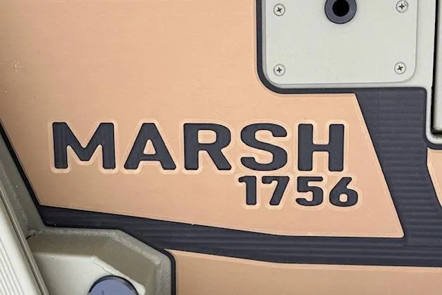 Slide: The Image of 2026 Tracker Grizzly 1756 T Marsh boat logo detail. - 21