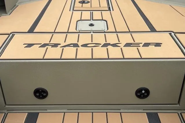 Slide: The Image of 2026 Tracker Grizzly 1756 T Marsh boat deck with logo and storage compartments. - 24