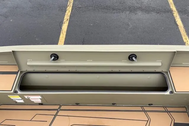 Slide: The Image of 2026 Tracker Grizzly 1756 T Marsh boat storage compartment, open view. - 29