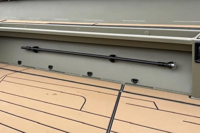 Slide: The Image of 2026 Tracker Grizzly 1756 T Marsh boat interior with rod holder and tan deck. - 31