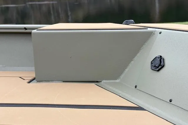 Slide: The Image of 2026 Tracker Grizzly 1756 T Marsh boat interior detail with beige and green design. - 78