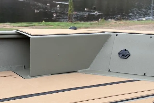 Slide: The Image of 2026 Tracker Grizzly 1756 T Marsh boat interior, featuring durable seating and storage. - 79