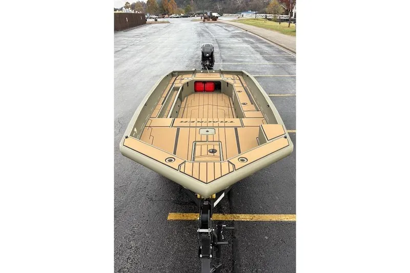 Slide: The Image of 2026 Tracker Grizzly 1756 T Marsh boat on trailer, parked on wet pavement. - 83