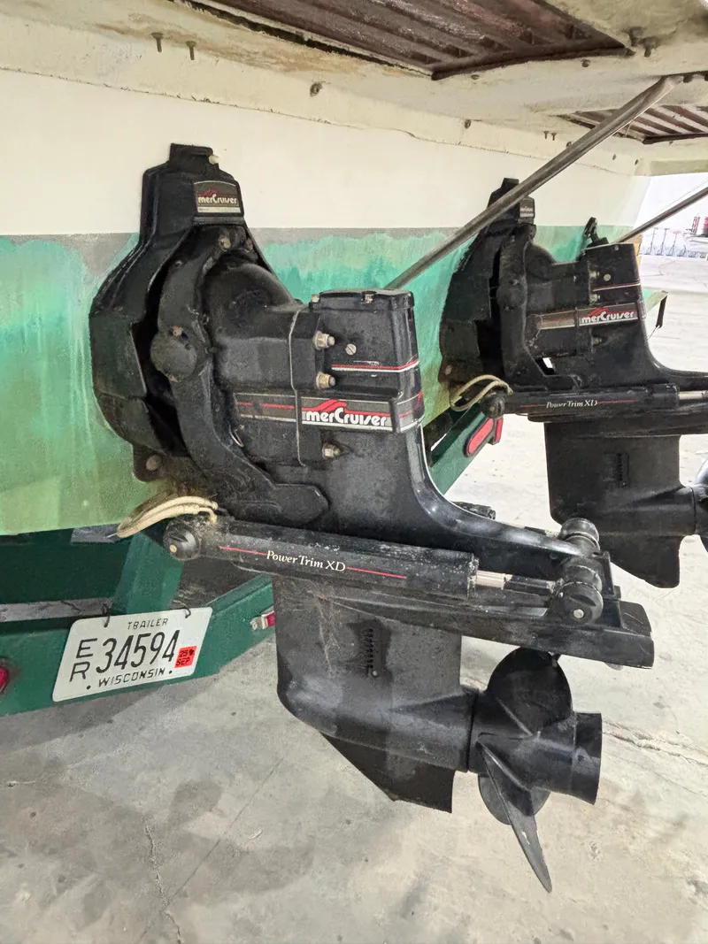 Slide: The Image of 1989 Sea Ray 290 Sundancer with MerCruiser Power Trim XD outdrives, Wisconsin trailer plate visible. - 7