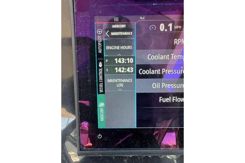 Slide: The Image of Display screen of 2023 NX Boats NX360 showing engine hours and maintenance data. - 10