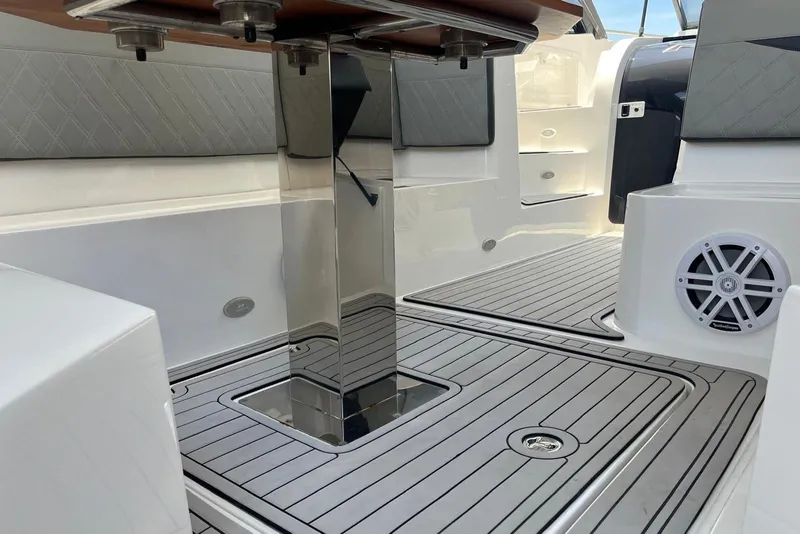 Slide: The Image of 2023 NX Boats NX360 interior with sleek flooring and modern design elements. - 21