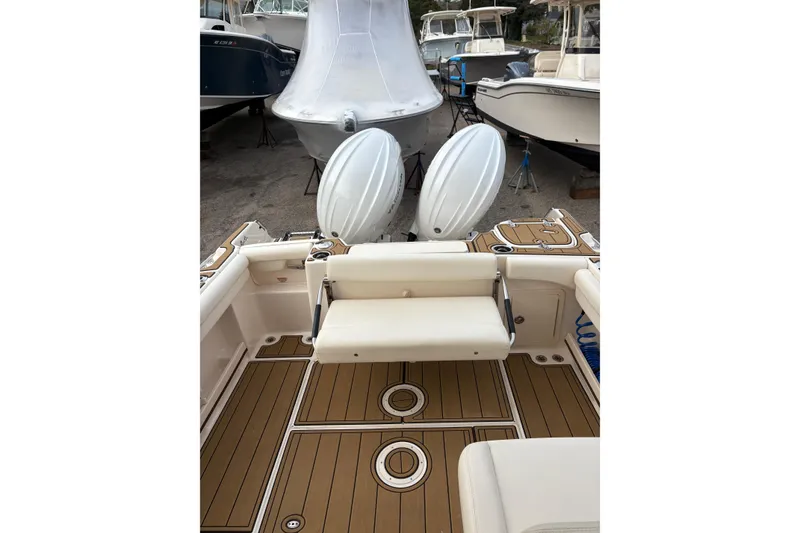 Slide: The Image of 2024 Grady-White Freedom 255 boat interior with seating and deck view. - 10