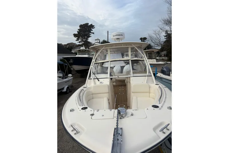 Slide: The Image of 2024 Grady-White Freedom 255 boat with spacious seating and Garmin equipment. - 6