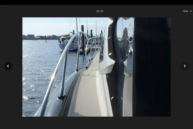 The Image of Side view of 2006 Azimut Atlantis 55 yacht docked in a marina. - 1