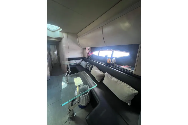 Slide: The Image of Interior of 2006 Azimut Atlantis 55 yacht with modern seating and glass table. - 11