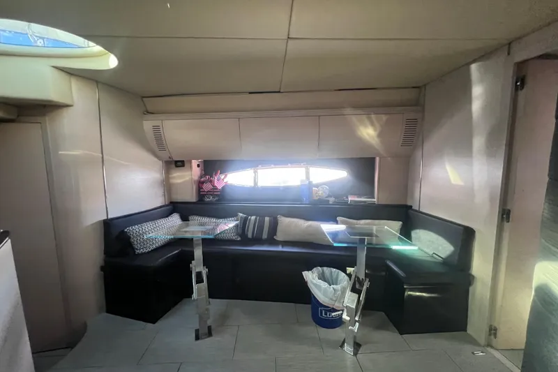 Slide: The Image of Interior of 2006 Azimut Atlantis 55 yacht with modern seating and glass tables. - 12