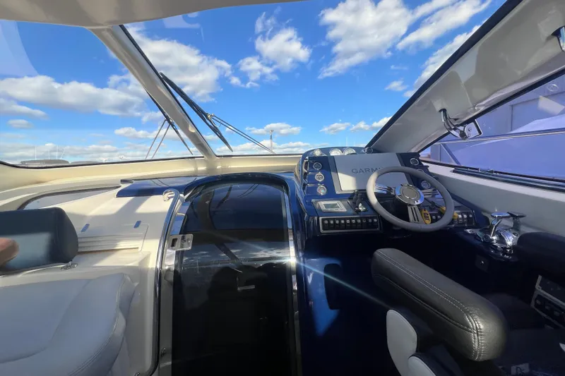 Slide: The Image of Interior view of 2006 Azimut Atlantis 55 yacht cockpit with steering wheel and navigation system. - 13