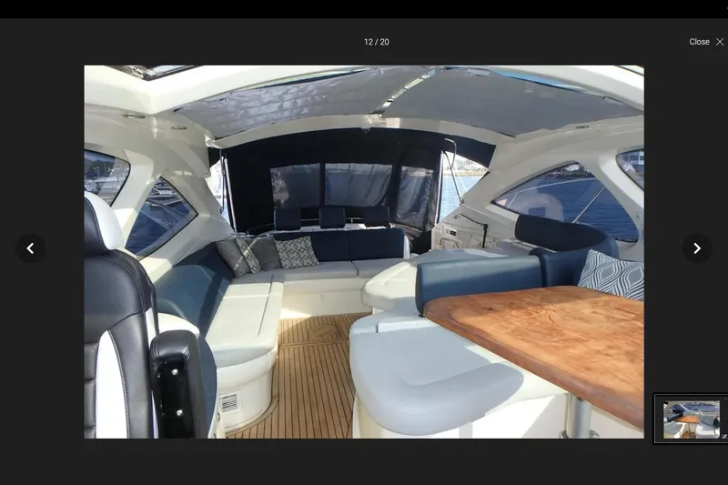 Slide: The Image of Interior of 2006 Azimut Atlantis 55 yacht with elegant seating and wooden table. - 3